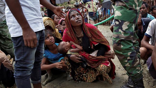 Rohingya Muslim refugees wait to receive aid in Cox’s Bazar, in Bangladesh, on September 27, 2017, after fleeing Myanmar. (Photo by Reuters)
