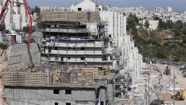 The photo shows a construction site for the Israeli settlement of Kiryat Arba, east the West Bank town of al-Khalil on August 24, 2017. (By AFP)
