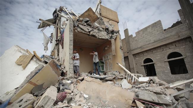 Boys stand on the rubble of a house destroyed by Saudi Arabia’s airstrikes in the Yemeni capital, Sana’a, on August 25, 2017. (Photo by AP)
