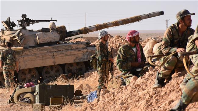 Syrian pro-government forces hold a position near the village of al-Maleha in the northern countryside of Dayr al-Zawr on September 9, 2017, during a battle against Daesh terrorists. (Photos by AFP)
