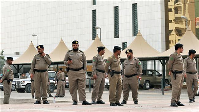 The file photo shows Saudi policemen standing guard in the capital Riyadh.