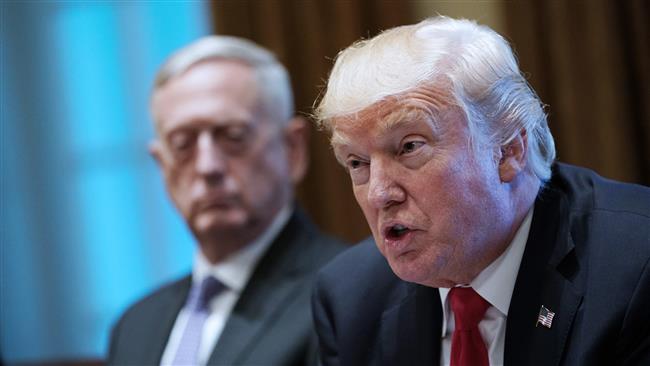 US President Donald Trump speaks as Defense Secretary James Mattis (L) looks on during a meeting with senior military leaders in the Cabinet Room of the White House on October 5, 2017. (Photo by AFP)
