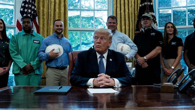 US President Donald Trump waits to speak during a proclamation signing in the Oval Office of the White House in Washington, DC, October 6, 2017. (Photo by AFP)

