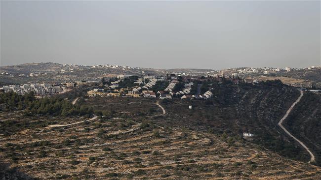 A picture taken on July 10, 2017 from the Palestinian village of Jania, west of Ramallah in the Israeli-occupied West Bank, shows the settlement of Talmon appearing in the background. (Photo by AFP)
