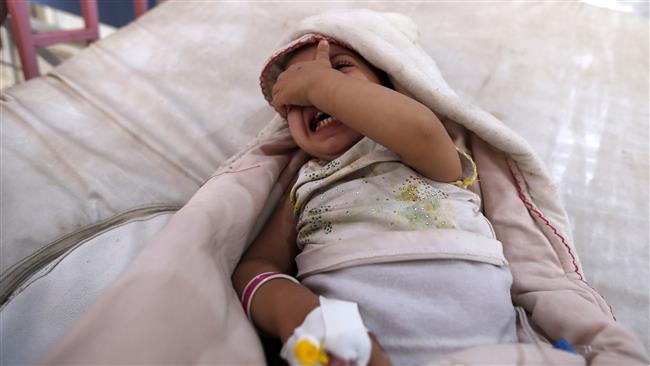 A yemeni child, who is suspected of being infected with cholera, cries at a hospital in the capital Sana