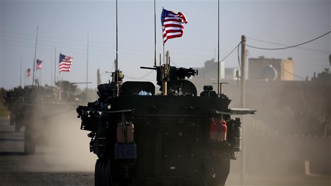 Picture taken on March 5, 2017 shows a convoy of US forces’ armored vehicles driving near the village of Yalanli, on the western outskirts of the northern Syria city of Manbij. (Photo by AFP)

