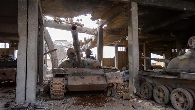 A picture taken during a press tour provided by the Russian Armed Forces on September 15, 2017 shows tanks inside a destroyed warehouse which was used by the Daesh terrorist group in the town of Uqayribat in Syria