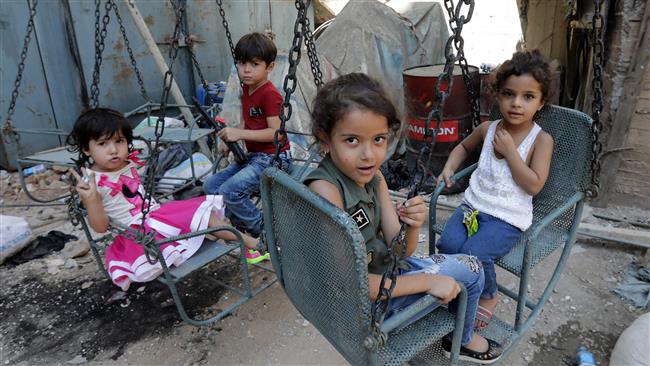 Syrian refugee children play on a street at Shatila refugee camp, on the southern outskirts of the Lebanese capital Beirut, on September 1, 2017. (Photo by AFP)
