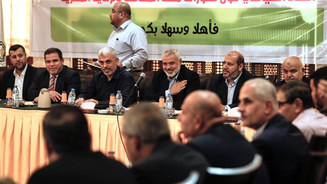 Senior political leader Ismail Haniyeh (4L) and Yahya Sinwar (3L), the new leader of the Hamas movement, attend a meeting with leaders of Palestinian factions in Gaza on September 25, 2017. (Photo by AFP)
