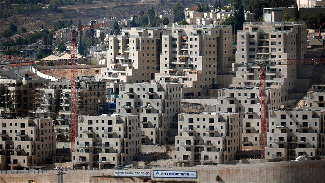 Buildings are seen under construction on October 17, 2017 at the Israeli settlement of Ramot, situated in a neighborhood of East Jerusalem al-Quds annexed by Israel but not recognized internationally. (Photo by AFP)
