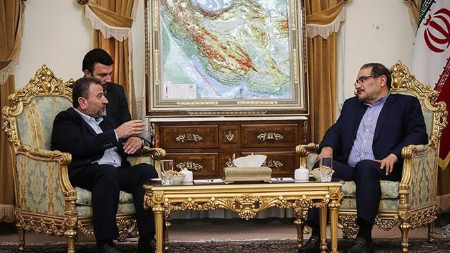 Secretary of Iran’s Supreme National Security Council Ali Shamkhani (R) and Deputy Head of Hamas