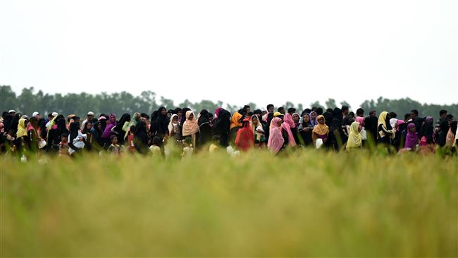 Rohingya Muslim refugees in Bangladesh wait for relief aid at Nayapara refugee camp in Teknaf, October 21, 2017. (Photo by AFP)
