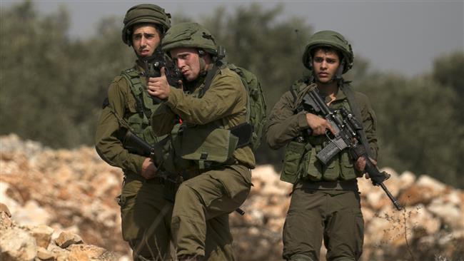 Israeli forces take aim during clashes with Palestinian demonstrators in the village of Kfar Qaddum, near Nablus, in the occupied West Bank, on October 20, 2017. (Photo by AFP)
