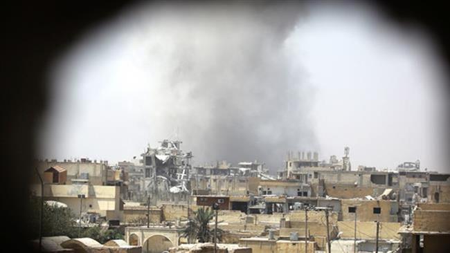 This file photo shows the aftermath of an airstrike in the Syrian city of Raqqah.
