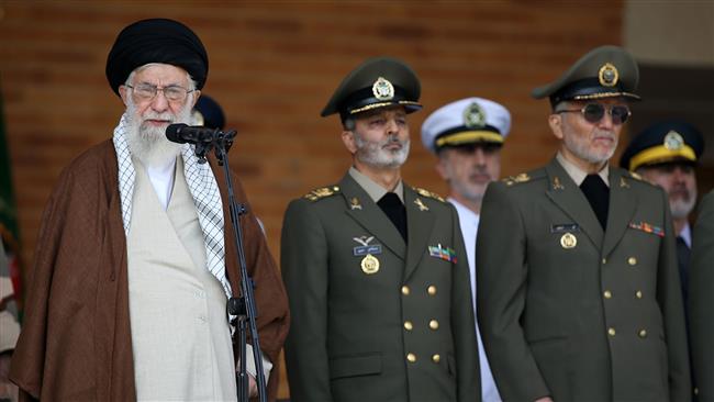 Leader of the Islamic Revolution Ayatollah Seyyed Ali Khamenei (L) speaks at a graduation ceremony of Iran
