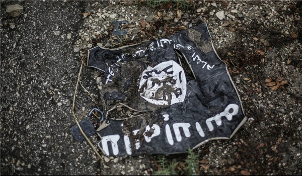 torn ISIL flag