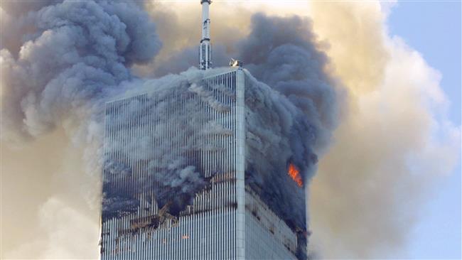 The photo shows the north tower of the World Trade Center on September 11, 2001. (Photo by AP)
