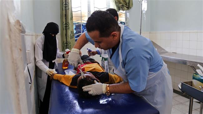 A Yemeni kid receives treatment at a hospital after he was reportedly injured in a Saudi airstrike on Ta