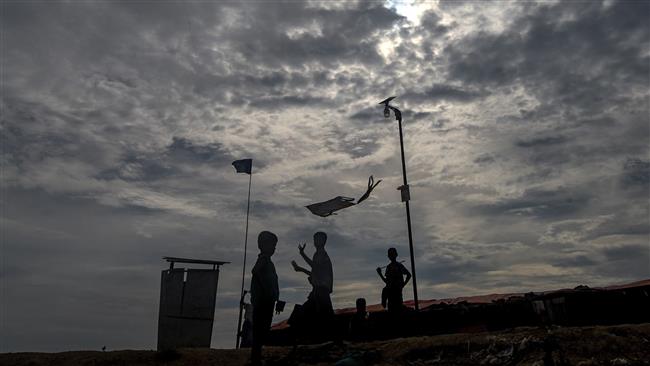 A Rohingya refugee child flies a kite at the Thankhali refugee camp in the Bangladeshi district of Ukhia on November 15, 2017. (Photos by AFP)
