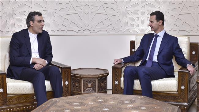 Iranian Deputy Foreign Minister for Arab and African Affairs Hossein Jaberi Ansari (L) meets with Syrian President Bashar al-Assad in the Syrian capital, Damascus, November 16, 2017.
