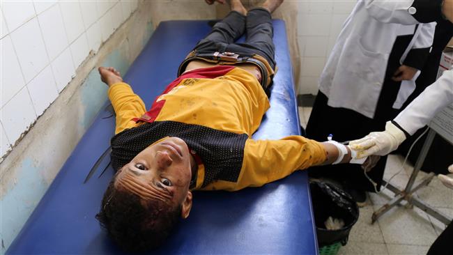 A Yemeni youth receives treatment at a hospital after he was injured in a Saudi-led coalition airstrike targeting Houthis and their allies in Ta