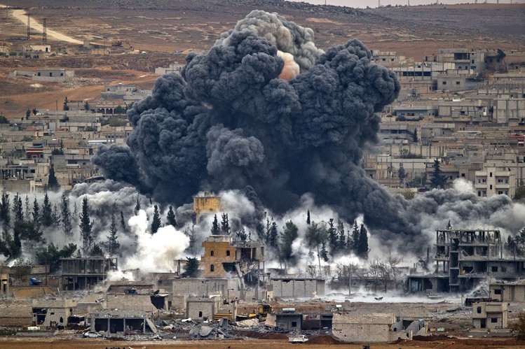 Smoke rises from the Syrian city of Kobani following an airstrike by the US-led Coalition