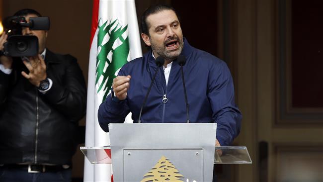 Lebanese Prime Minister Saad Hariri speaks to his supporters outside his residence in Beirut, Lebanon, November 22, 2017. (Photo by AP)
