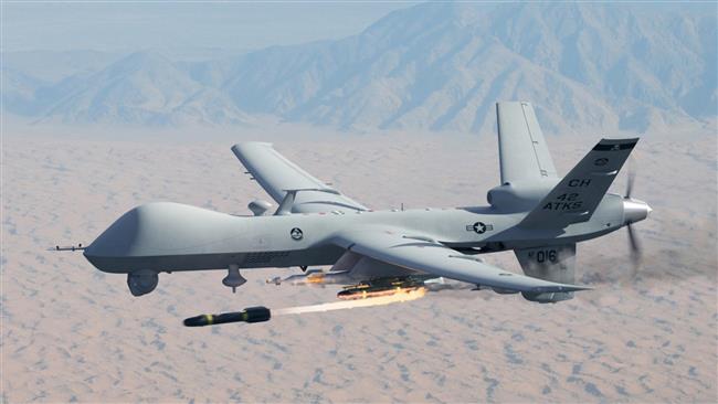 a US MQ-9 Reaper drone firing a Hellfire missile.