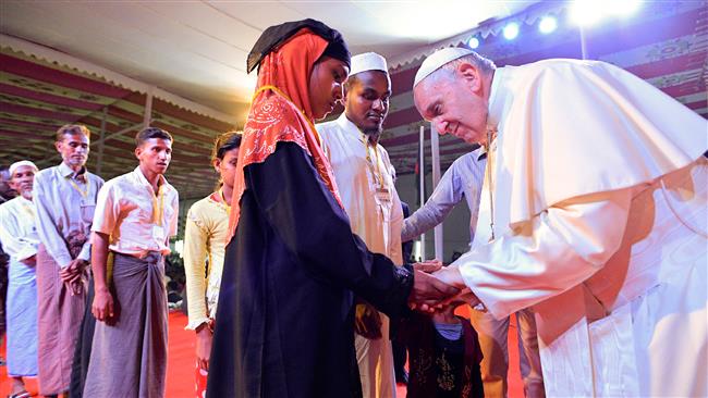Pope Francis meets a group of Rohingya refugees during an inter-religious conference at St. Mary
