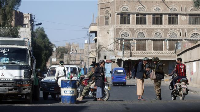 Houthi fighters man a checkpoint in the Yemeni capital, Sana