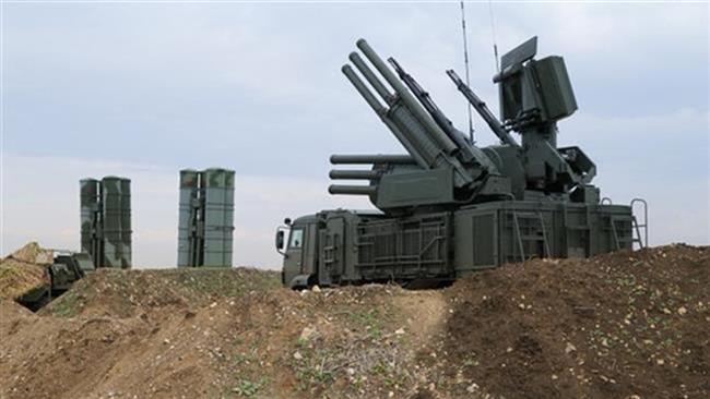 Russian Pantsir-S1 air defense weapon system, foreground, and the S-400 long-range air defense missile systems in Syria (Photo by AP)
