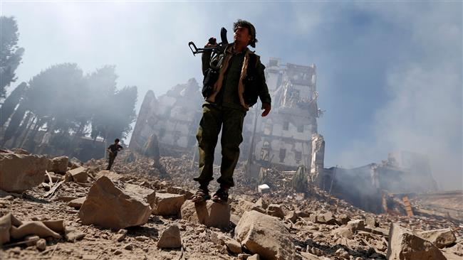 Members of Yemen’s Ansarullah movement inspect the damage after a Saudi airstrike targeted the presidential palace in the Yemeni capital Sana