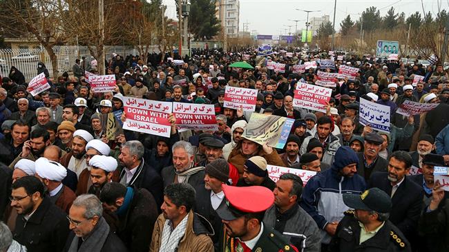 Iranians carry banners during protests in support of Palestinians on Dec. 8, 2017. (Photo by IRNA)
