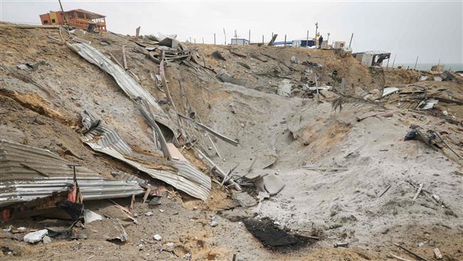 A picture taken on March 18, 2017 shows a blast crater at the site Israeli airstrike against a Hamas facility, north of Gaza City. (Photo by AFP)
