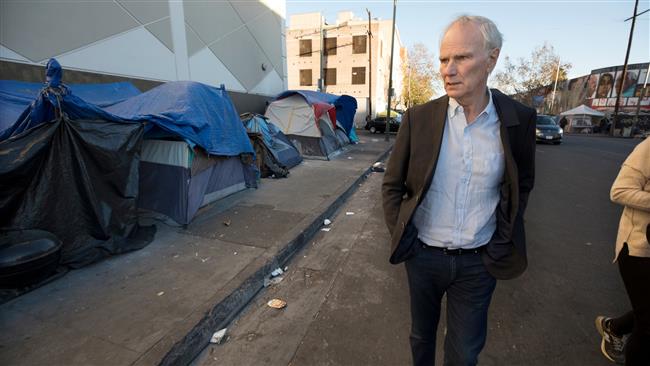 Philip Alston seen visiting a homeless camp in Downtown, Los Angeles, California (Photo via The Guardian)
