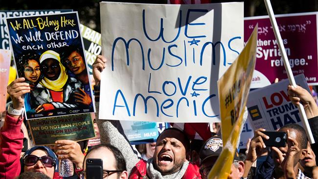 This file photo taken on October 18, 2017 shows demonstrators chanting during a #NoMuslimBanEver rally and march "to protest discriminatory policies that unlawfully target and hurt American Muslim and immigrant communities across the country" in Washington, DC. (Photo by AFP)
