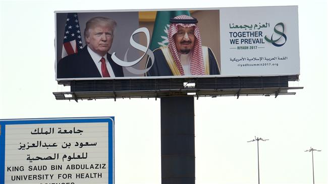 A giant billboard bearing portraits of US President Donald Trump and Saudi Arabia’s King Salman is seen on a main road in Riyadh, on May 19, 2017. (Photo by AFP)
