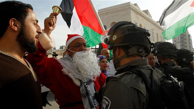 Palestinian protesters argue with Israeli forces in the West Bank city of Bethlehem, December 23, 2017. (Photo by AFP)
