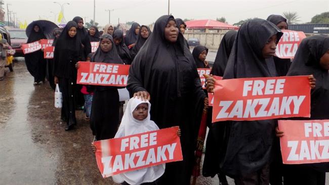 This file photo taken on August 11, 2016 in northern Nigerian city of Kano shows protesters from the Islamic Movement in Nigeria (IMN) marching in the rain through the streets to press for the release of their leader Ibrahim Zakzaky. (Photos by AFP)
