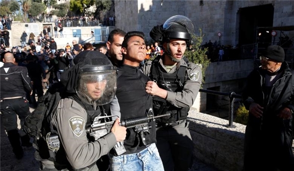 Israeli soldiers arrest a Palestinian young man