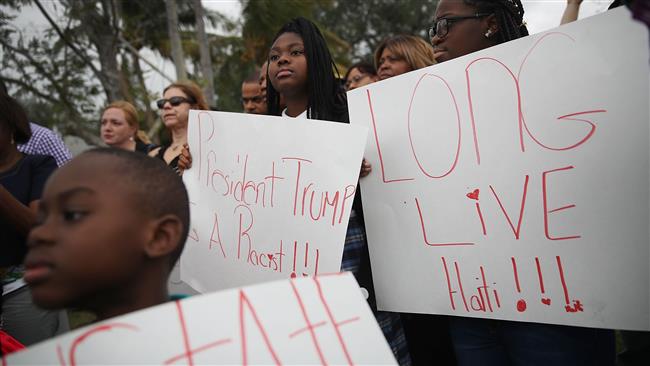 Haitians who live in Miami, Florida, join together to mark the 8th anniversary of the massive earthquake in Haiti and to condemn President Donald Trump