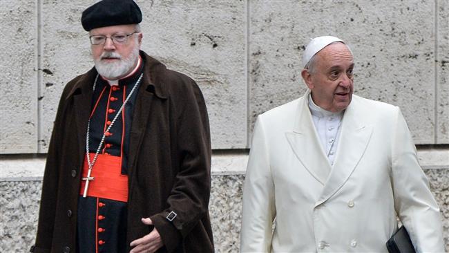 This file photo, taken on February 13, 2015, shows Pope Francis (R) and US Cardinal Sean Patrick O’Malley as they arrive to take part with cardinals and bishops in the Papal consistory before the nominations of new cardinals, at the Vatican. (By AFP)
