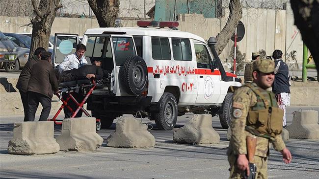 Afghan aid workers transfer a man wounded in a bomb attack to hospital, central Kabul, January 27, 2018.
