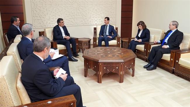 Syrian President Bashar al-Assad (C-R) receives Iranian Deputy Foreign Minister for Arab and African Affairs Hossein Jaberi Ansari (C-L) in Damascus, Syria, on January 27, 2018. (Photo by SANA)