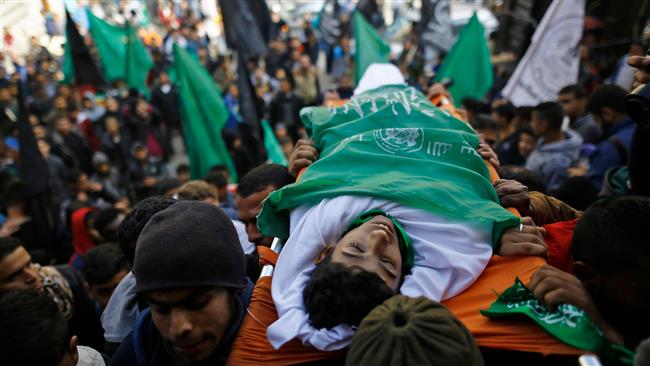 Palestinian mourners carry the body of Amir Abu Musaid, 16, during his funeral in the al-Maghazi refugee camp, located in the center of the Gaza Strip, after he was shot dead in clashes with the Israeli military along the Gaza border the previous day, on January 12, 2018. (Photo by AFP)
