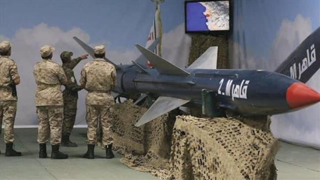 Yemeni soldiers stand next to a domestically developed Qaher-2 missile. (File photo)
