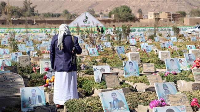 A man stands at a graveyard for fighters of the Houthi Ansarullah movement in Sa’ada, Yemen, on January 30, 2018. (Photo by Reuters)
