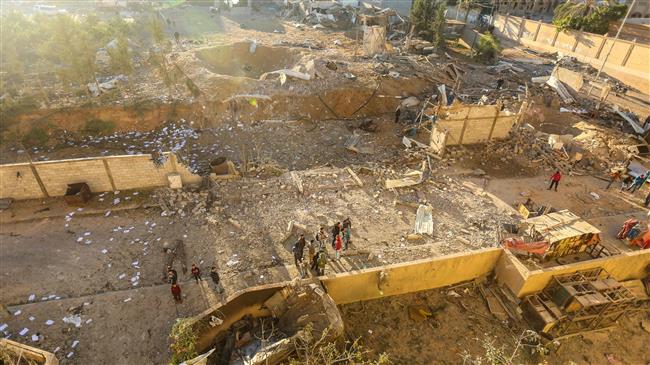 Palestinians look at the damage at a Hamas military facility early on December 9, 2017, in the aftermath of an Israeli air strike in Beit Lahia, in the northern Gaza Strip. (Photo by AFP)
