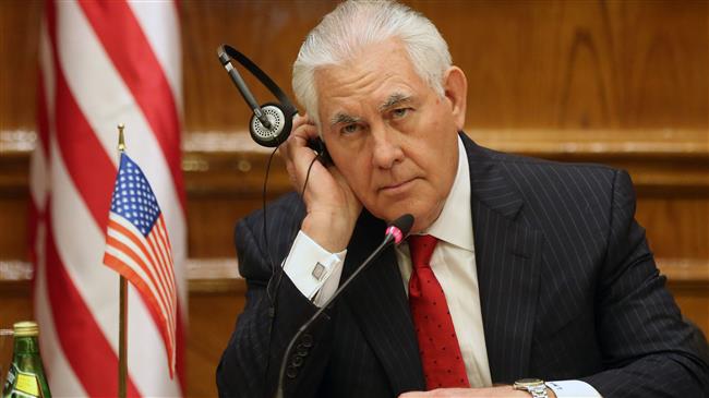 US Secretary of State Rex Tillerson listens with a headphone during a joint press conference with Jordan