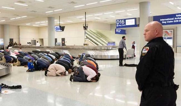 Muslims say their prayers at an airport in US